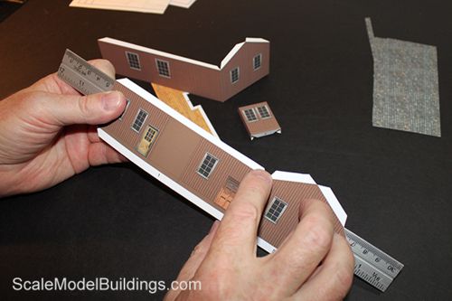 assembling a cardstock building for model trains